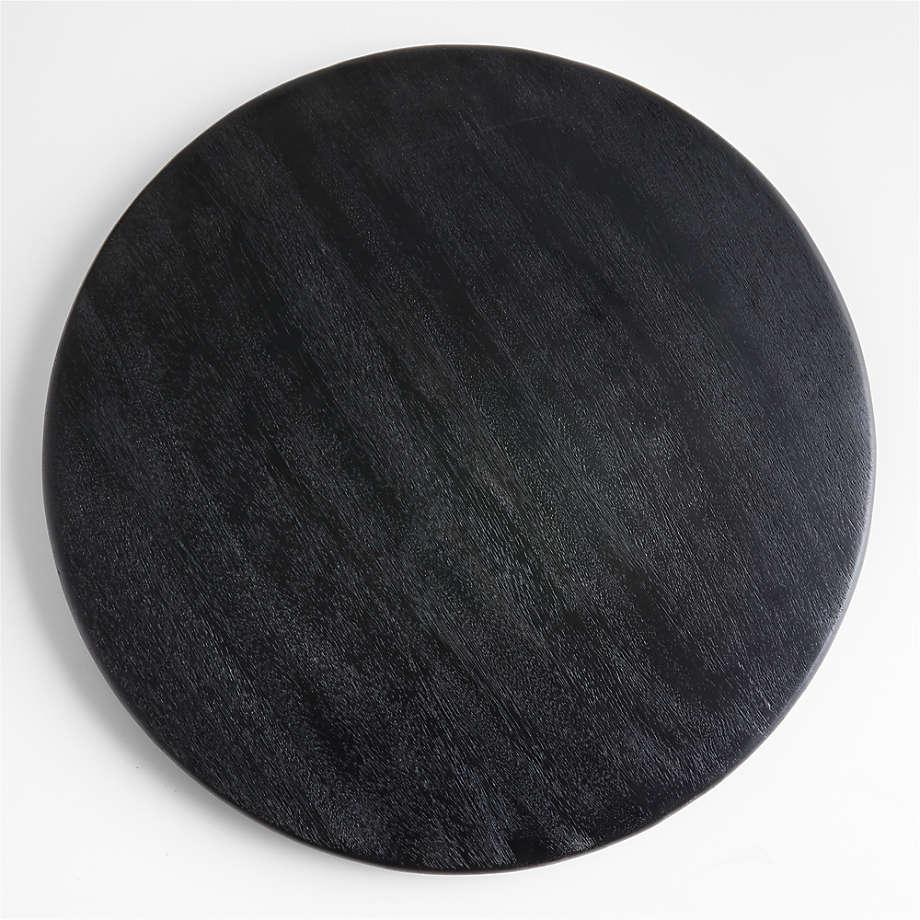 Round black ash wood cutting board with subtle wood grain and smooth rounded edge, shown flat on a white background.