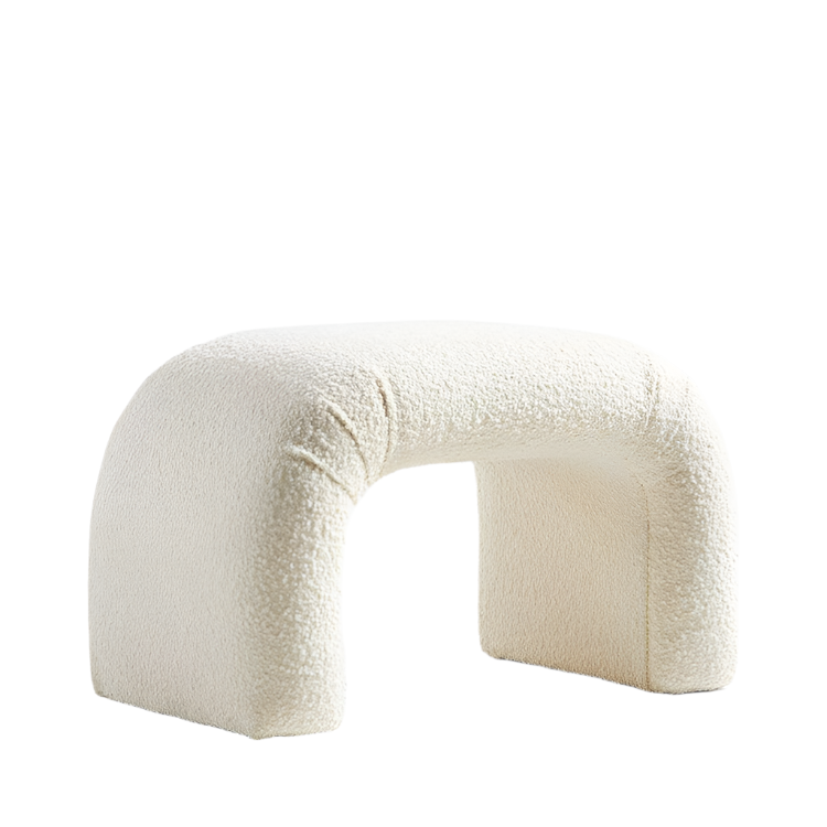 Cream boucle upholstered vanity stool with a rounded arched silhouette, backless padded seat and fully covered block legs, shown on a white background.