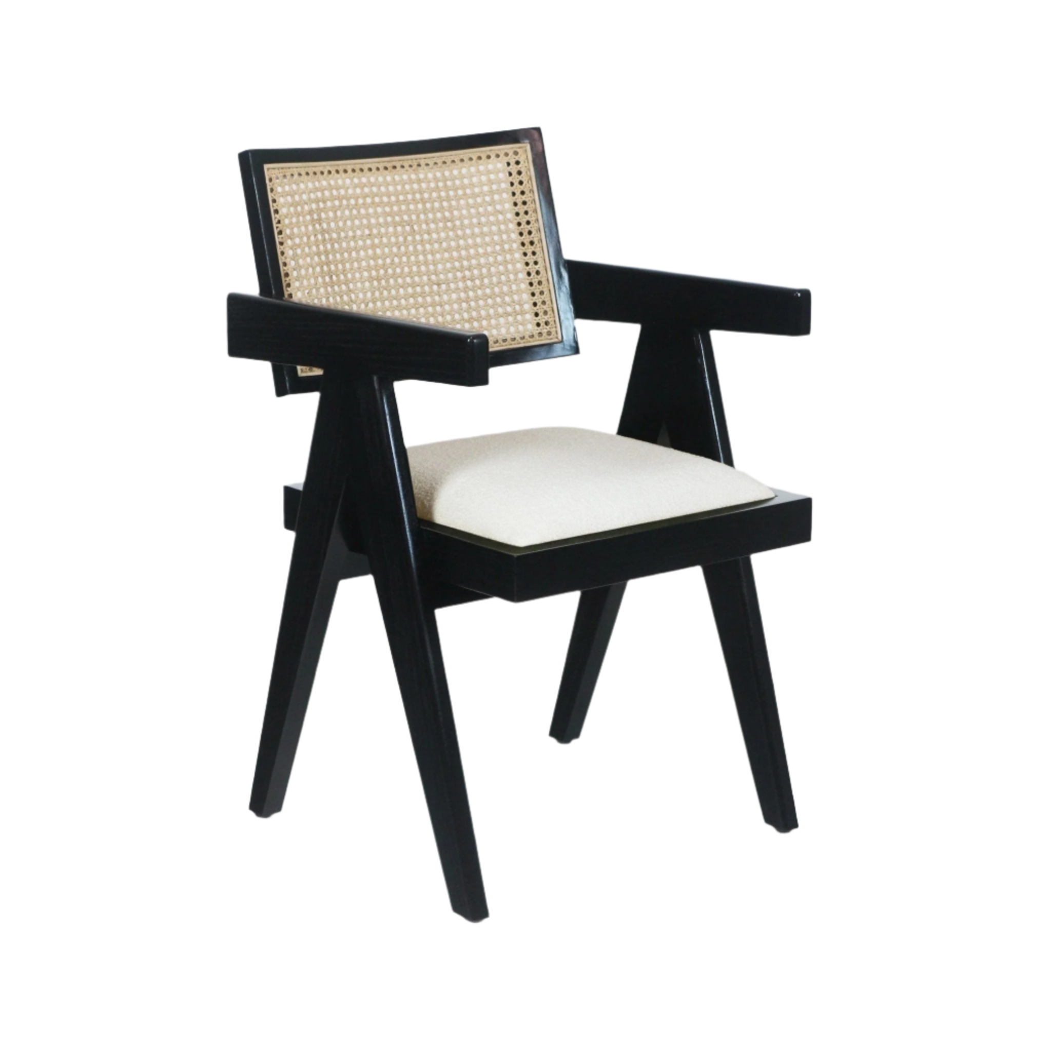 Mid-century modern black wood dining chair with a woven natural cane back, angled legs and arms, and a cream upholstered seat cushion.
