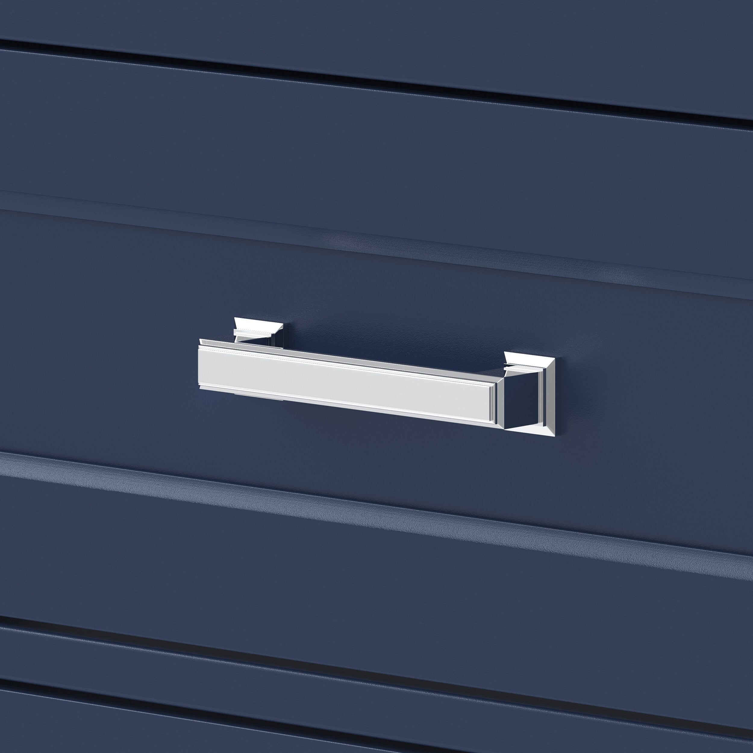 Close-up of a polished chrome rectangular drawer pull mounted on a deep navy wood vanity drawer front, showing beveled edge details and contemporary glam styling.