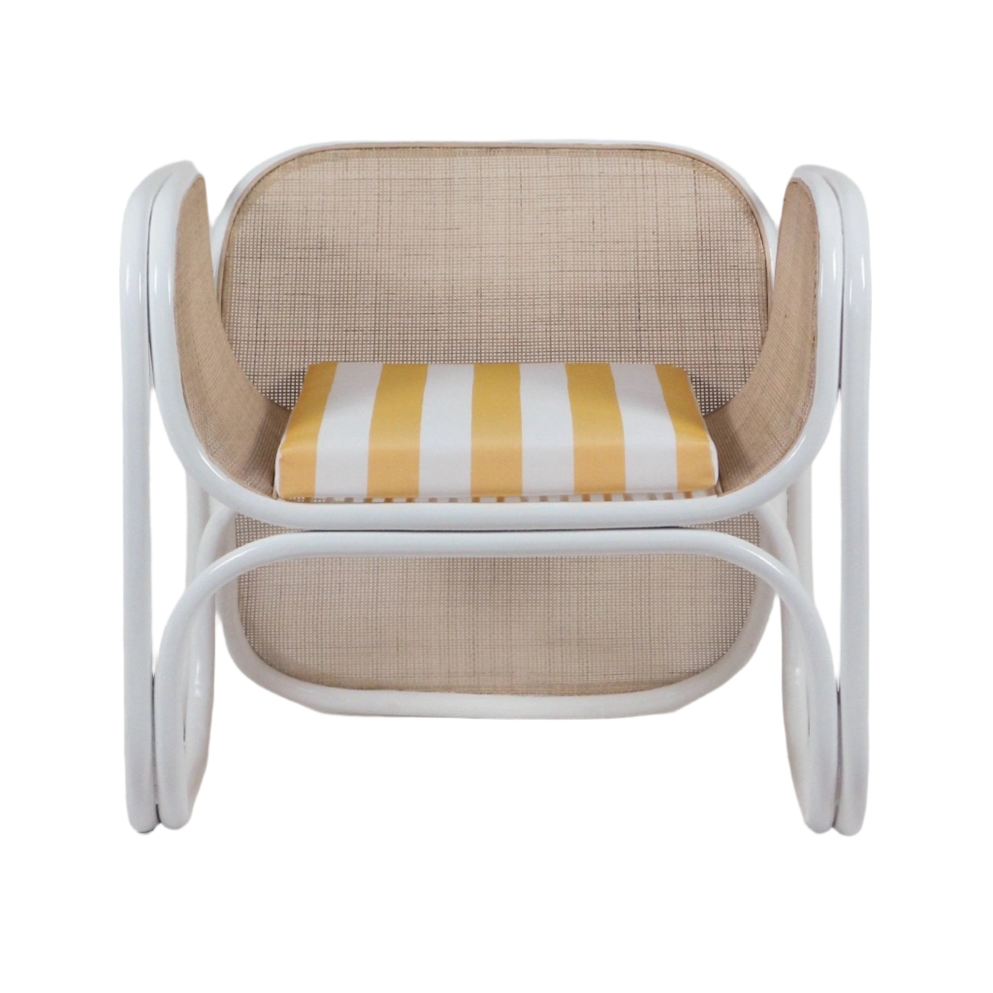 Modern lounge chair with curved white metal frame and natural cane back and sides, featuring a yellow-and-white striped fabric seat cushion.