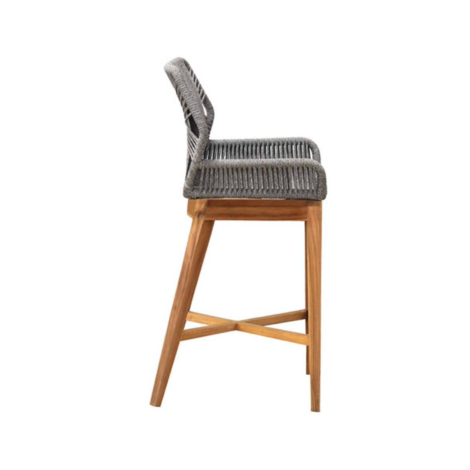 Side view of a coastal-style outdoor bar stool with a natural teak frame, angled legs and cross stretcher, and a grey woven rope seat and low back showcasing textured rope detailing and solid wood construction.