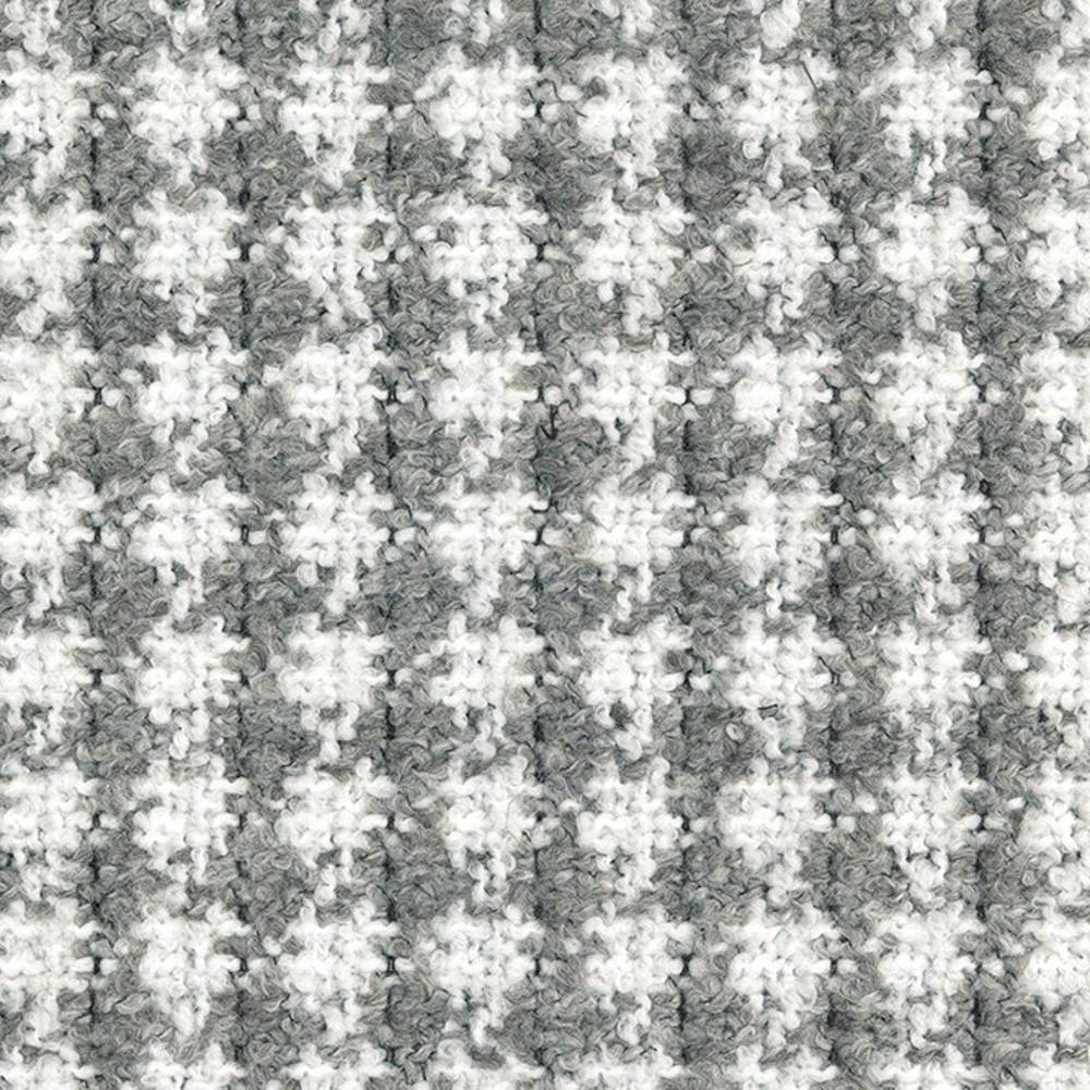 Close-up of gray and white boucle upholstery fabric with a small-scale houndstooth check, showing looped texture and soft pile; 70% acrylic, 30% polyester ideal for contemporary sofa upholstery.