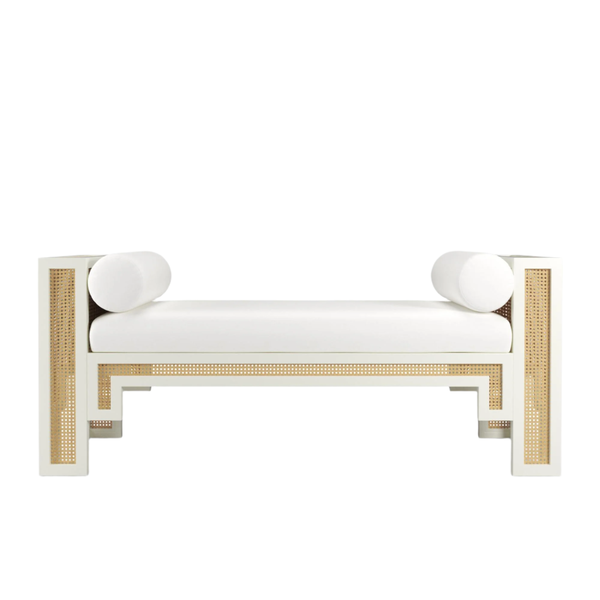 White upholstered 59-inch end-of-bed bench featuring natural rattan cane panels, painted solid wood frame and two cylindrical white bolster pillows in a boho-Scandinavian style.
