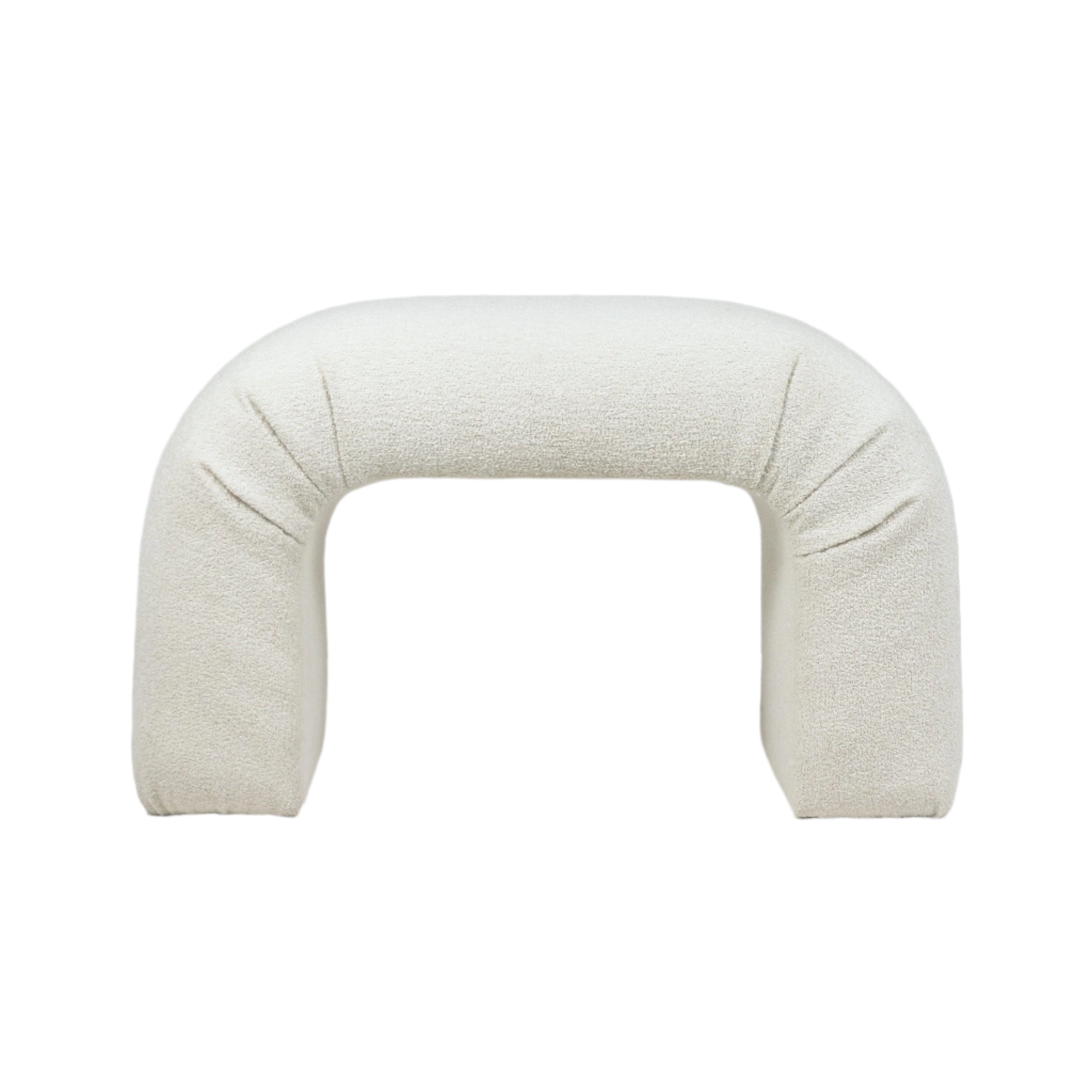 Cream boucle upholstered arched vanity seat with a rounded U-shape and cushioned, backless design shown on a white background.