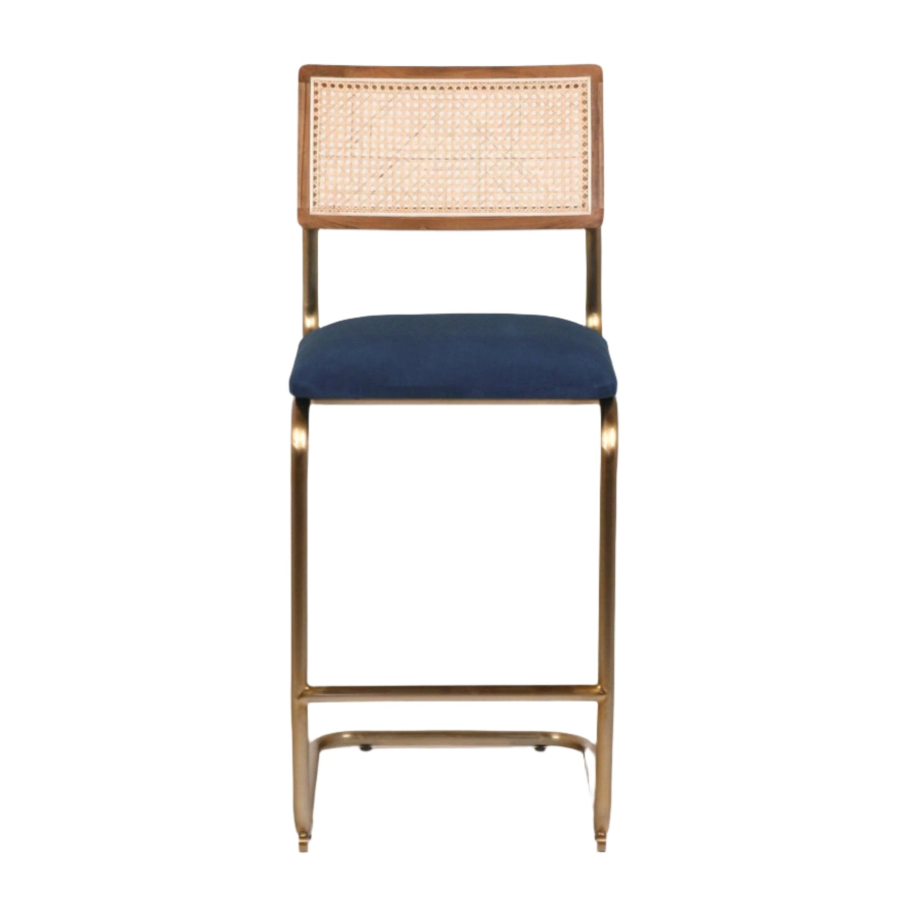 Front view of a cantilever bar stool with a navy velvet upholstered seat, natural woven cane back in a wood frame, and a gold-brass metal cantilever base with integrated footrest.