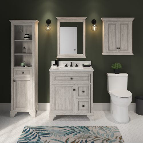 Modern white solid-wood 31-inch single-sink vanity with white quartz top, black matte faucet and hardware, shown with matching tall linen cabinet, wall cabinet and framed mirror against a dark green wall.