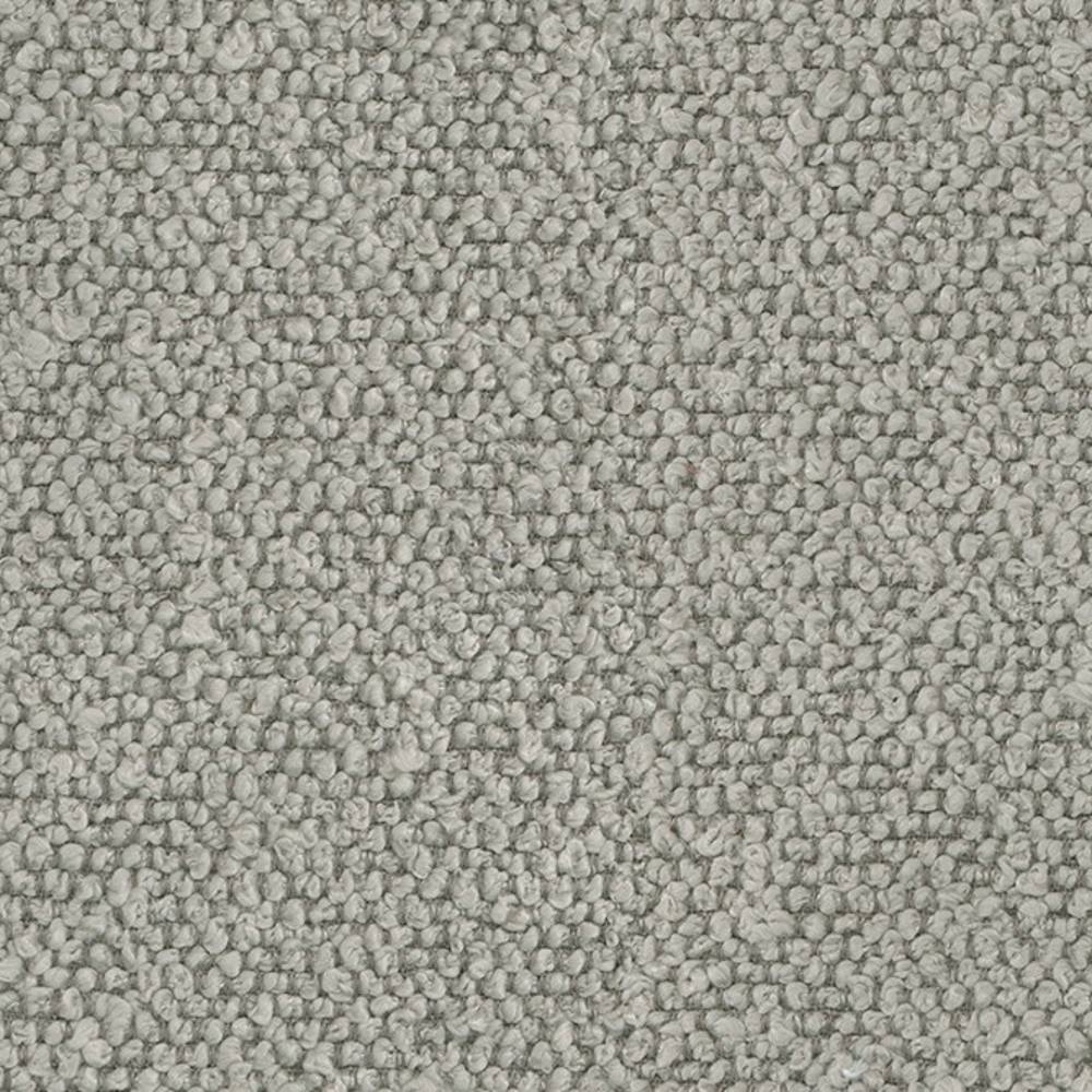 Close-up of neutral cream 100% polyester upholstery fabric showing dense looped bouclé texture with small pebble-like loops, ideal for sofas and modern interiors.