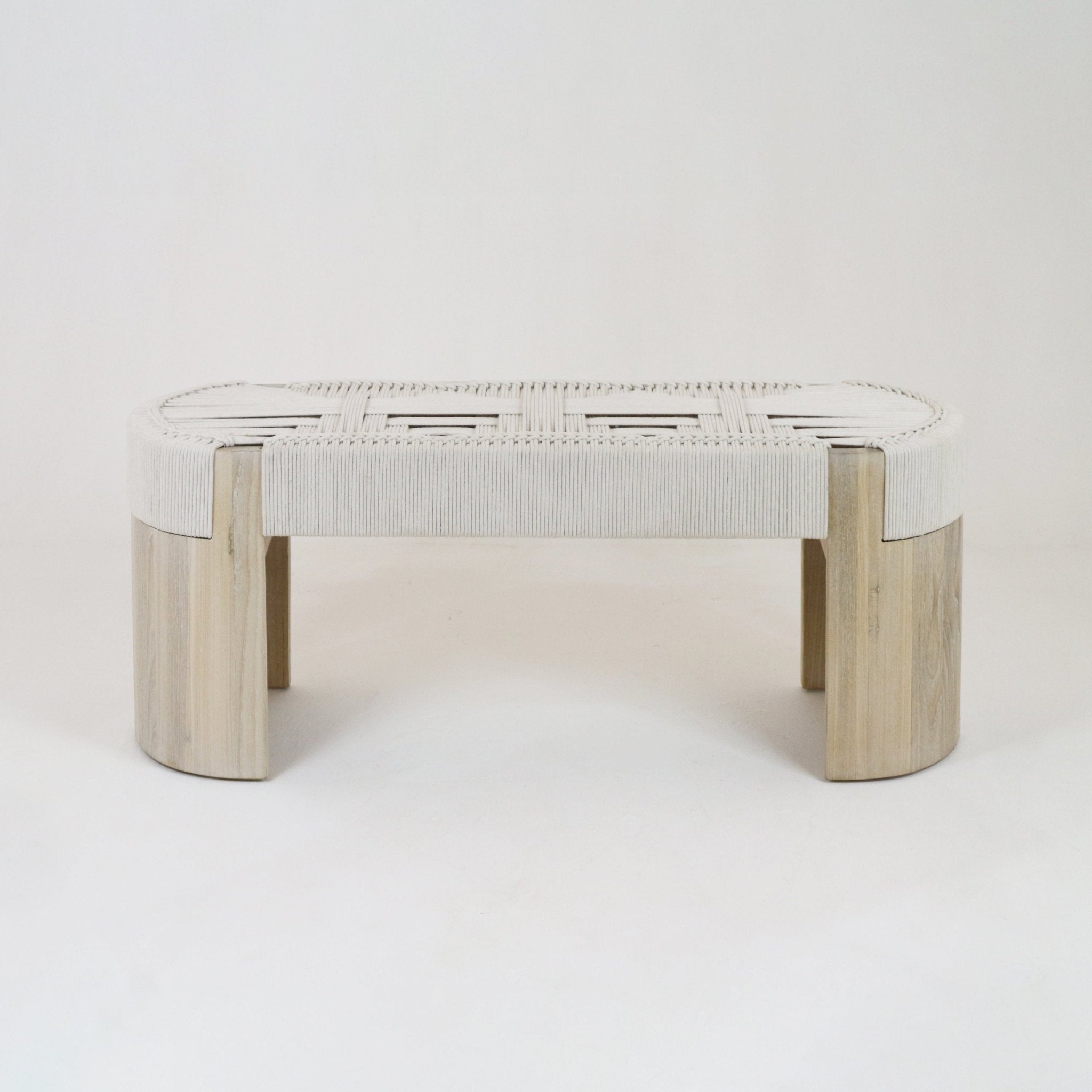 Modern low-profile entryway bench with a woven cream rope fabric seat in a basket-weave pattern supported by rounded natural oak legs.