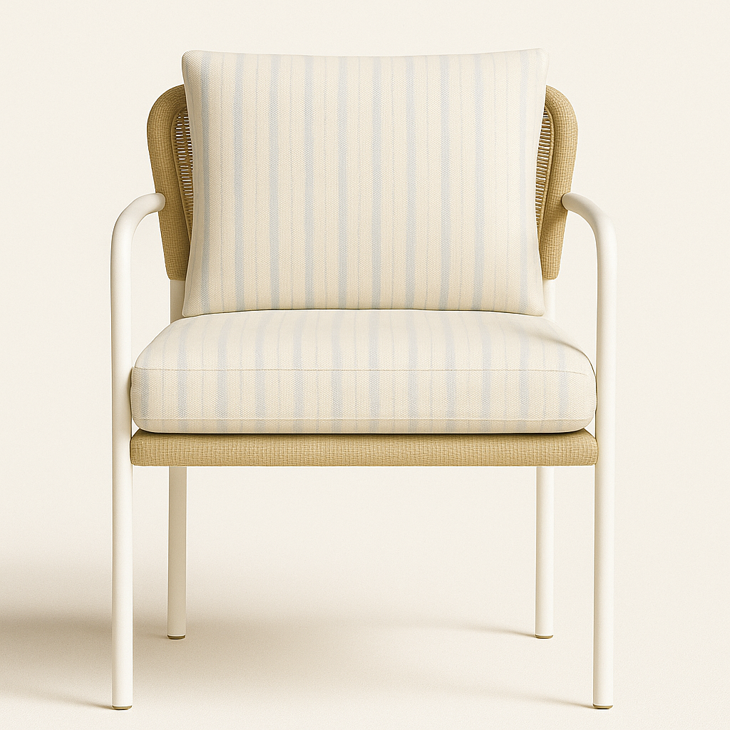 Front view of a coastal outdoor accent chair with a white aluminum frame, tan woven wicker back accents and a cream-and-light-blue striped fabric seat and back cushion.