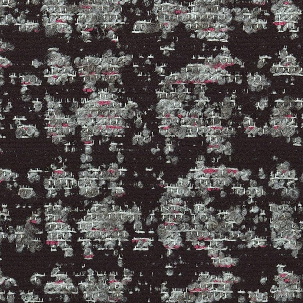 Close-up of viscose-blend black upholstery fabric showing textured gray and white woven loops with small pink accent threads in an irregular speckled pattern.